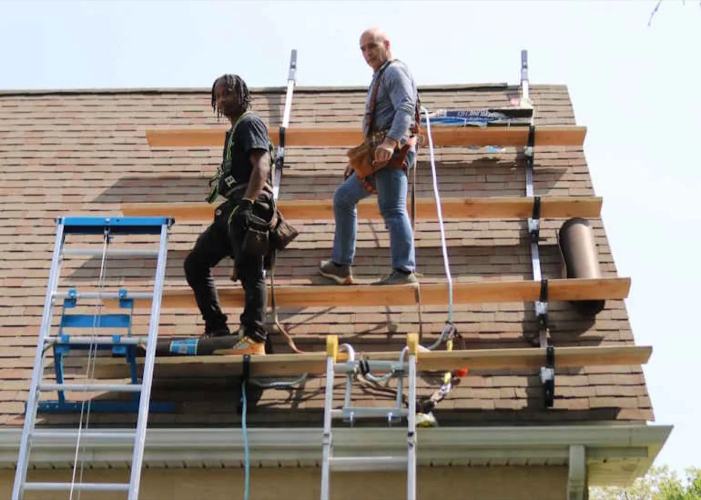 W Contracting crew at work on a roof